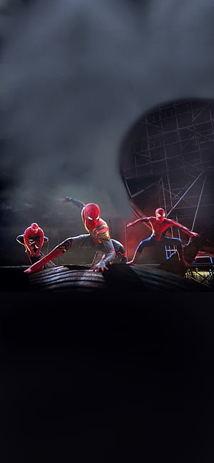 Three Spider-Men in Action Poses on Industrial Scaffolding in Dark Foggy Setting HD phone wallpaper