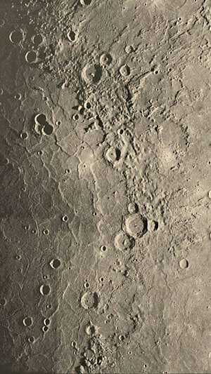 Close-up view of the Moon's cratered surface with impact basins and rugged lunar terrain HD phone wallpaper