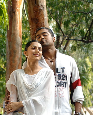 Sillunu Oru Kadhal Romantic Couple Embrace Under Tree in White Attire HD phone wallpaper
