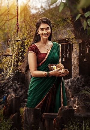 Pooja Hegde in Green Saree Holding Coconut Offering in Temple Setting HD phone wallpaper