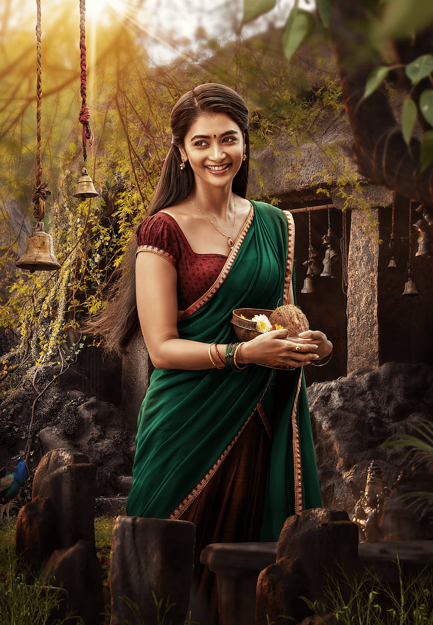Pooja Hegde in Green Saree Holding Coconut Offering in Temple Setting HD phone wallpaper