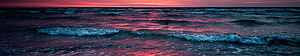 Vibrant Sunset Ocean Waves with Crimson Sky Reflections on Dark Water HD wallpaper