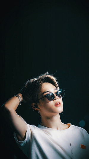 Park Jimin of BTS in Round Sunglasses and White T-Shirt Against Dark Background HD phone wallpaper