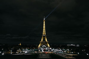 Eiffel Tower Illuminated Against Dark Night Sky in Paris France HD wallpaper