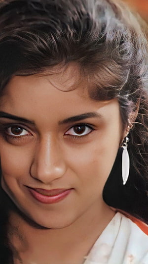 Revathi Portrait: Close-Up of the Multilingual Actress with Curly Hair and Dangling Earrings HD phone wallpaper