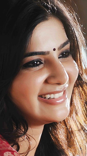 Samantha smiling close-up portrait with bindi and warm lighting HD phone wallpaper