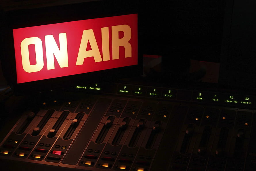 Illuminated On Air Sign Above Professional Audio Mixing Console in Dark Broadcast Studio HD wallpaper