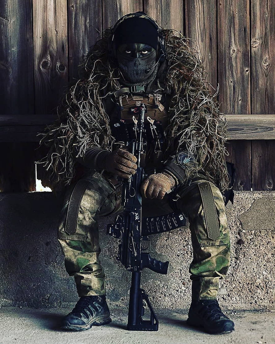 Para Commando Soldier in Ghillie Suit Holding Rifle Against Wooden Barn Wall HD phone wallpaper