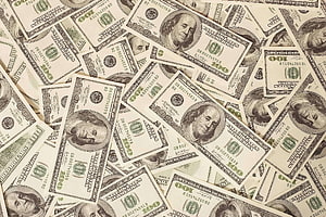 Scattered US One Hundred Dollar Bills Featuring Benjamin Franklin Portrait HD wallpaper