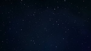 Deep Space Starfield with Scattered Bright Stars Against a Dark Night Sky HD wallpaper