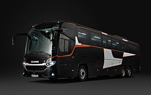 Scania Interlink Black Coach Bus with Orange and White Accents on Dark Background HD wallpaper