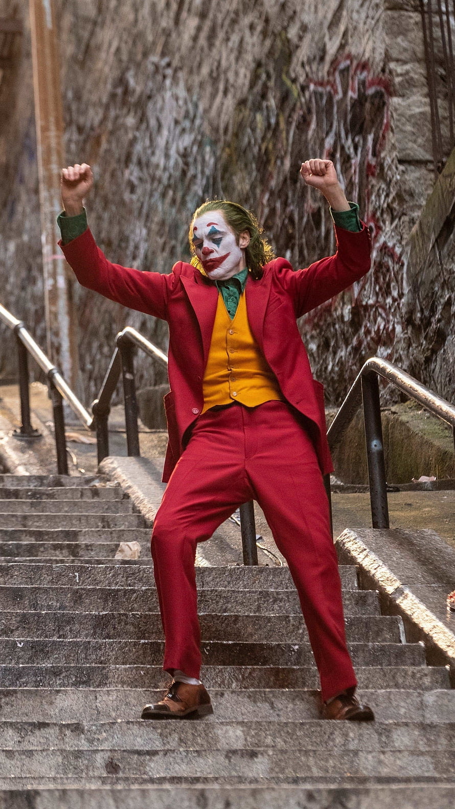 Joker Dancing on Stairs in Red Suit with Clown Makeup HD phone wallpaper