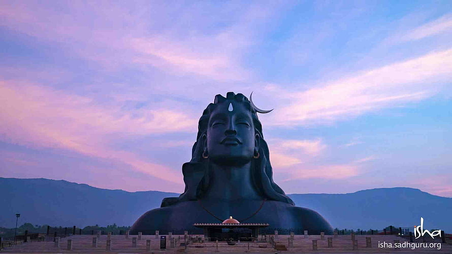 Adiyogi Statue at Isha Yoga Center Against a Pastel Sunset Sky HD wallpaper