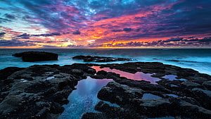 Vibrant Coastal Sunset with Turquoise Tidal Pools and Dramatic Clouds HD wallpaper