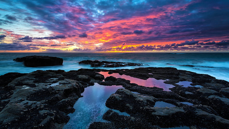 Vibrant Coastal Sunset with Turquoise Tidal Pools and Dramatic Clouds HD wallpaper
