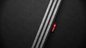 Adidas Three-Stripe Fabric Texture with Red Logo Tag on Black Woven Material HD wallpaper