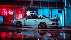 White Porsche 911 Turbo Widebody in Neon-Lit Cyberpunk Street Scene HD wallpaper
