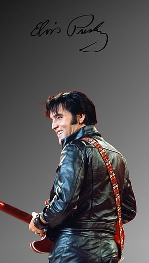 Elvis Presley in Black Leather Jacket Holding Electric Guitar on Stage HD phone wallpaper
