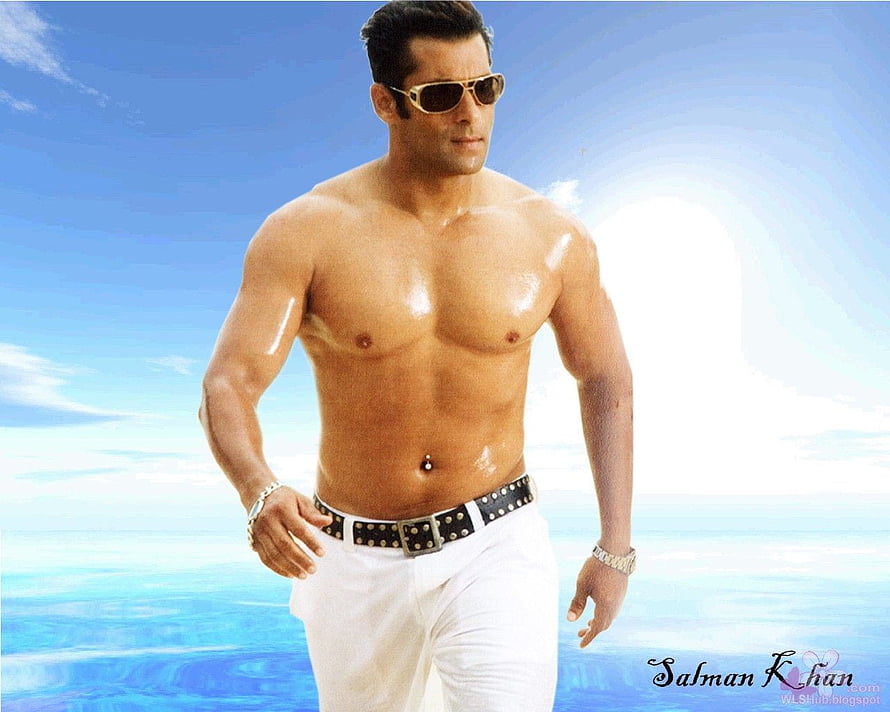 Salman Khan shirtless portrait with sunglasses against a bright blue sky and ocean backdrop HD wallpaper