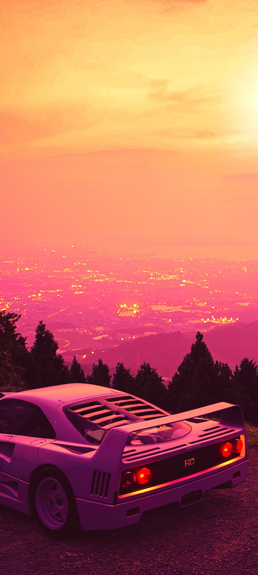 Retro Outrun Aesthetic: Classic Sports Car on a Hilltop at Sunset with Neon Pink Sky HD phone wallpaper