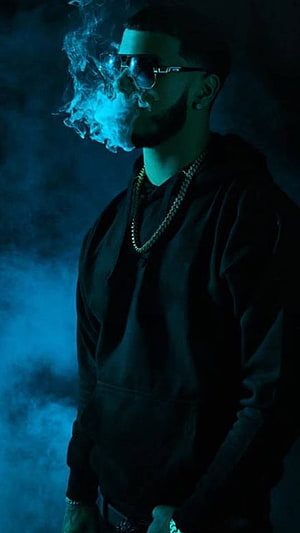 Anuel AA in dark blue lighting with smoke and sunglasses HD phone wallpaper