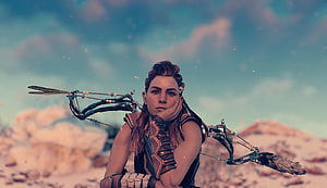 Aloy from Horizon Zero Dawn holding a bow in a desert landscape HD wallpaper