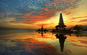 Pura Ulun Danu Beratan Temple Silhouetted Against a Vibrant Sunset Sky Over Lake Beratan in Bali HD wallpaper