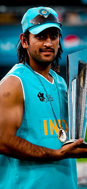 Mahendra Singh Dhoni Holding Cricket Trophy in India Blue Jersey HD phone wallpaper