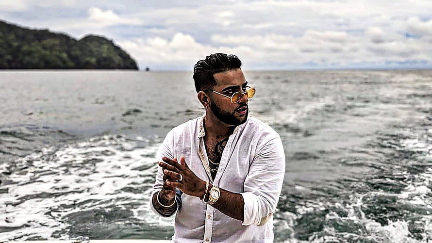 Karan Aujla in White Linen Shirt and Sunglasses on a Boat HD wallpaper