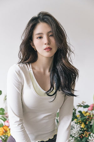 Han So Hee Portrait in Cream Top with Floral Background HD phone wallpaper