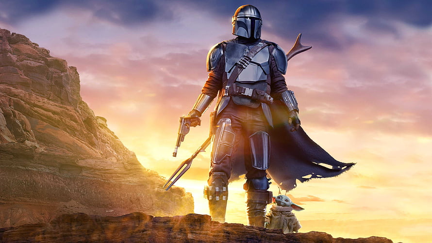 The Mandalorian and Grogu Standing on a Rocky Cliff at Sunset HD wallpaper