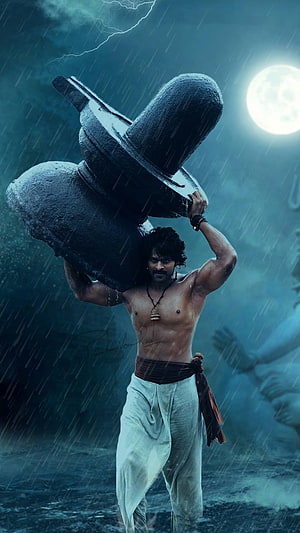 Prabhas as Baahubali Carrying Stone Mortar in Stormy Rain HD phone wallpaper
