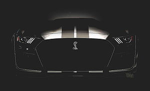 Front View of Black Ford Mustang Shelby GT500 with Racing Stripes and Cobra Emblem HD wallpaper