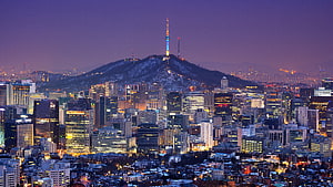 Seoul Cityscape at Dusk with Namsan Tower Illuminated Against a Purple Sky HD wallpaper