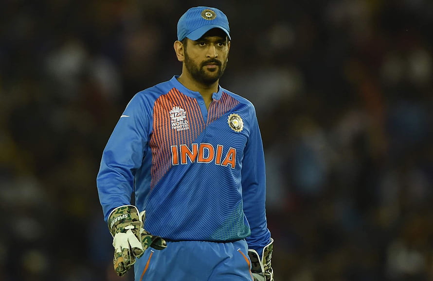 MS Dhoni in India Cricket Team Jersey Wearing Wicketkeeping Gloves on the Field HD wallpaper