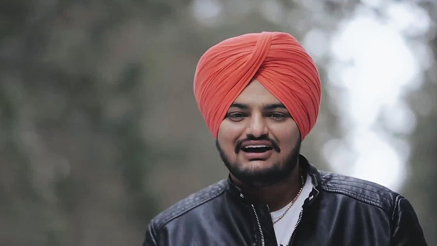 Sidhu Moose Wala Portrait in Red Turban and Black Leather Jacket HD wallpaper