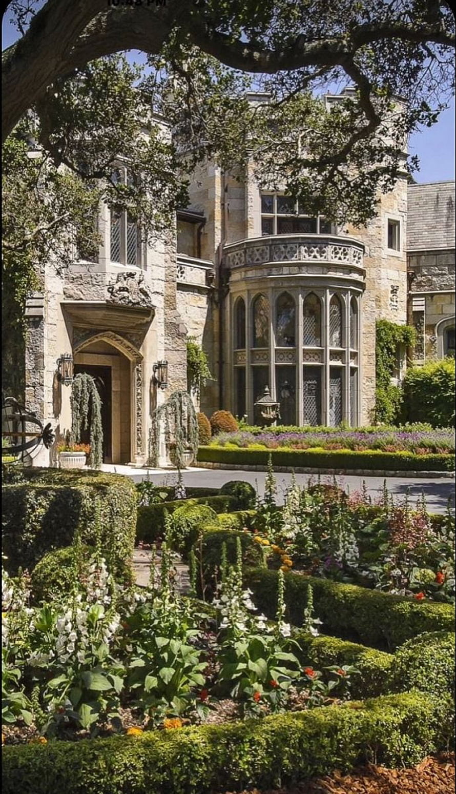 Historic Stone Manor House With Ornate Bay Window And Manicured Formal Garden HD phone wallpaper