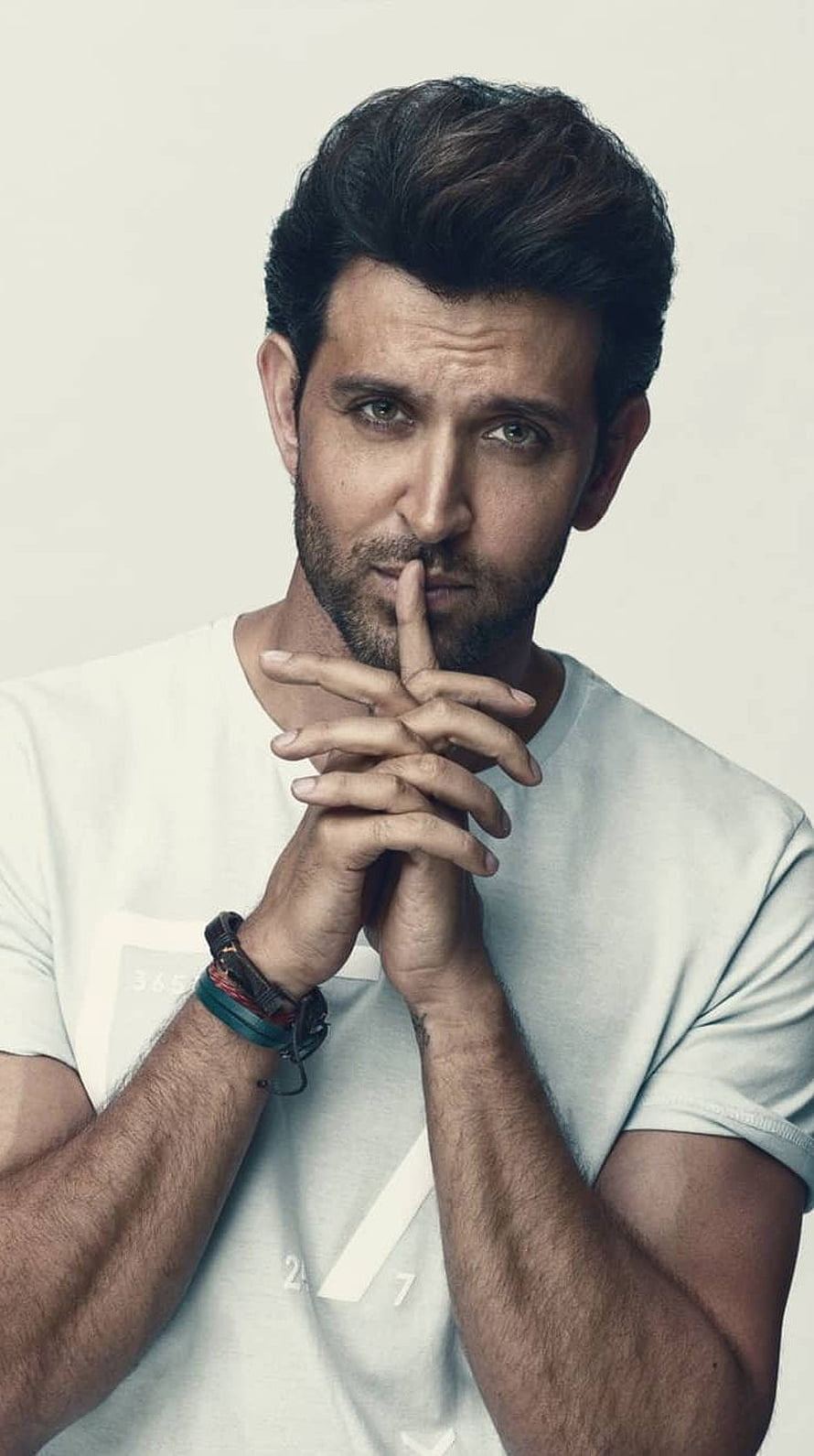 Hrithik Roshan Pensive Portrait in White T-Shirt with Finger to Lips HD phone wallpaper