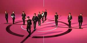 The Boyz K-pop Group Concept Photo in Black Outfits on Vibrant Pink Stage HD wallpaper