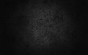 Dark Grunge Texture with Subtle Scratches and Speckles on Black Background HD wallpaper