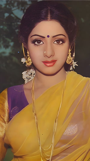 Sridevi in a Yellow Saree with Gold Jewelry and Floral Hair Adornment HD phone wallpaper