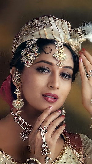 Madhuri Dixit in Traditional Indian Bridal Attire with Ornate Jewelry and Headpiece HD phone wallpaper