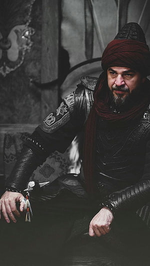 Ertugrul Ghazi in Dark Leather Armor and Red Turban HD phone wallpaper