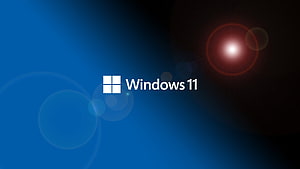 Windows 11 Blue and Black Gradient with Lens Flare and Logo HD wallpaper