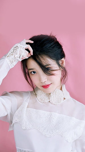 IU in a White Lace Blouse with a Soft Pink Studio Backdrop HD phone wallpaper