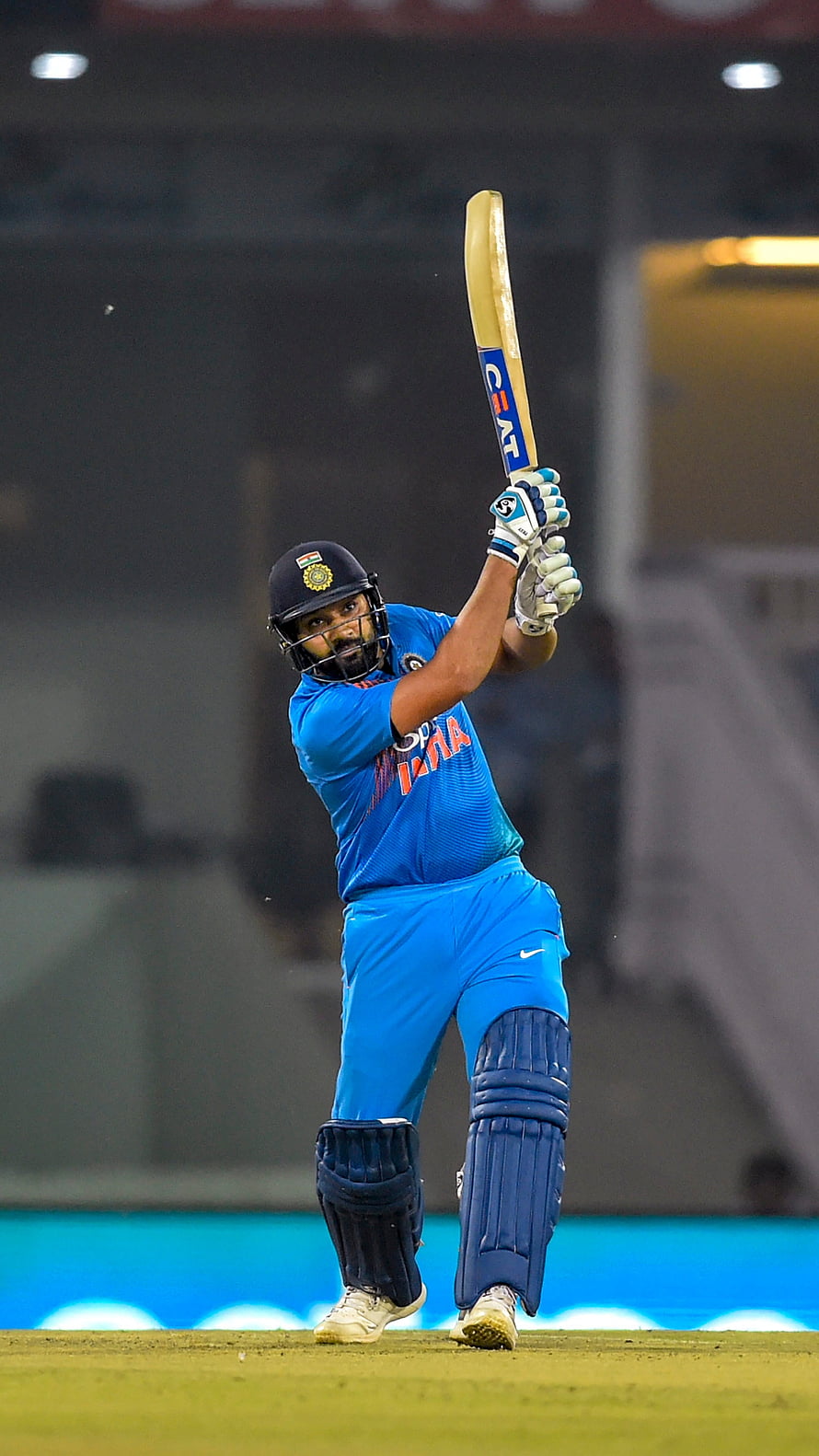 Rohit Sharma in India Blue Kit Executing a Powerful Cricket Batting Stroke HD phone wallpaper