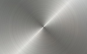 Radial brushed steel texture with concentric circular grain and diagonal light reflection HD wallpaper