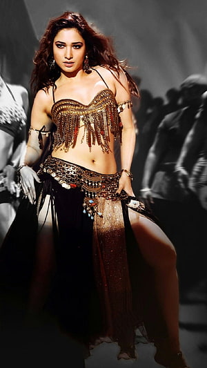 Tamanna Bhatia in an ornate gold and black belly dance costume with intricate beaded fringe and coin details HD phone wallpaper