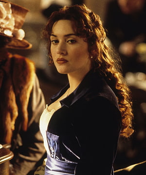 Kate Winslet as Rose in Titanic, vintage period costume with warm cinematic lighting HD phone wallpaper