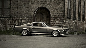 1967 Ford Mustang Shelby GT500 Eleanor in front of an abandoned brick building HD wallpaper